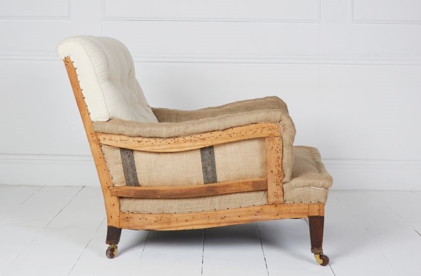Edwardian very deep seated armchair covered in Egyptian calico and natural hessian