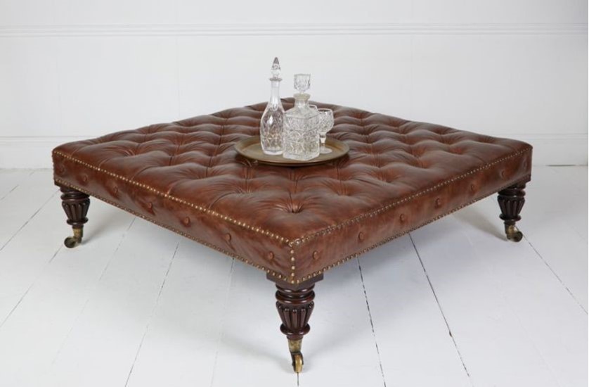 Traditionally upholstered tufted stool in Italian hand antiqued hide